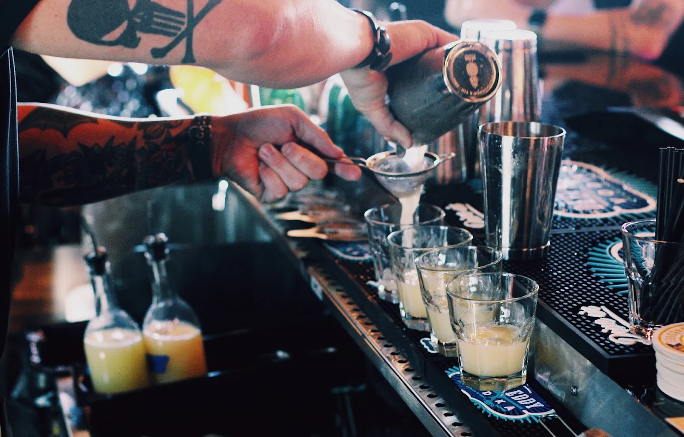 Fat Kat Slim's bartender pouring drinks